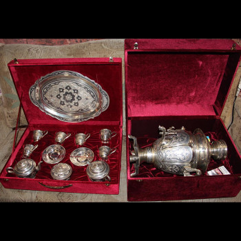 Silver samovar and tea set with a tray