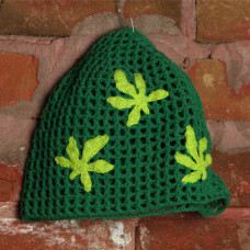 Knitted green hat with hemp leaves