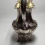 Silver milk jug with gilding in the middle