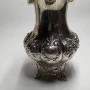 Silver milk jug with gilding in the middle