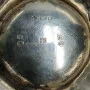 Silver milk jug with gilding in the middle